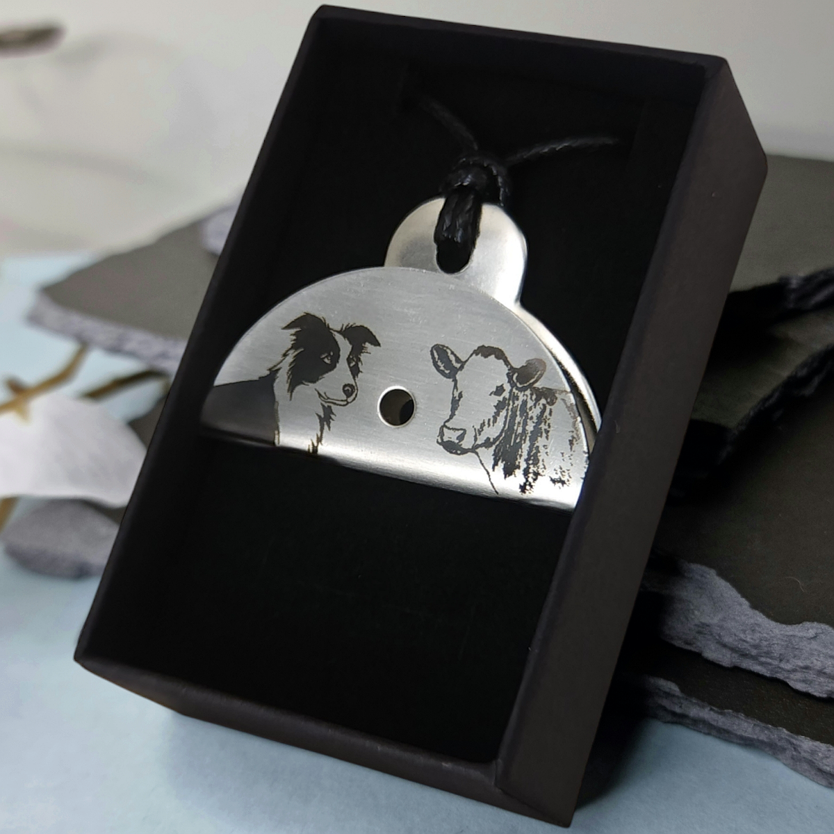 Stainless Steel Whistle pendant with engraved dog and cow design in a black gift box
