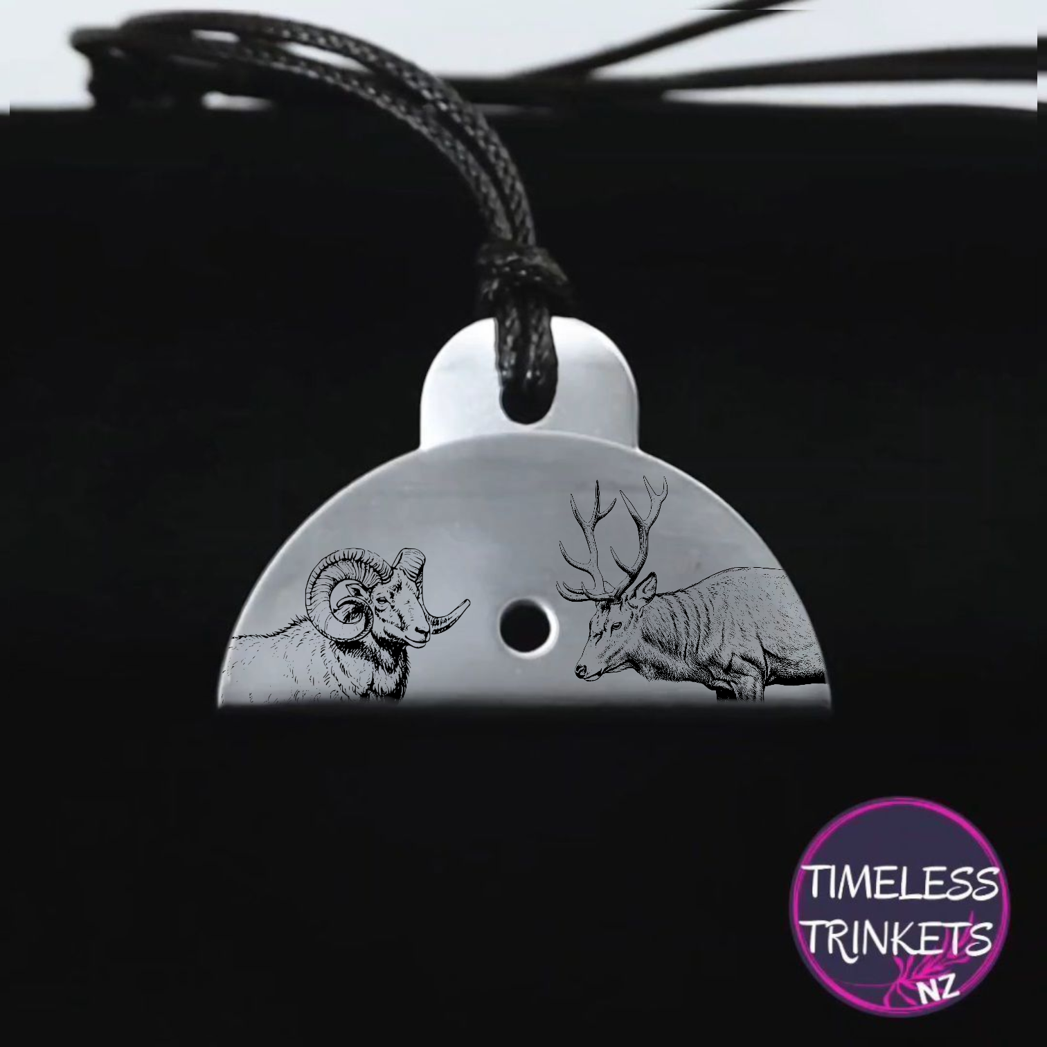 Stainless steel shepherds whistle with engraved images of a ram and a deer