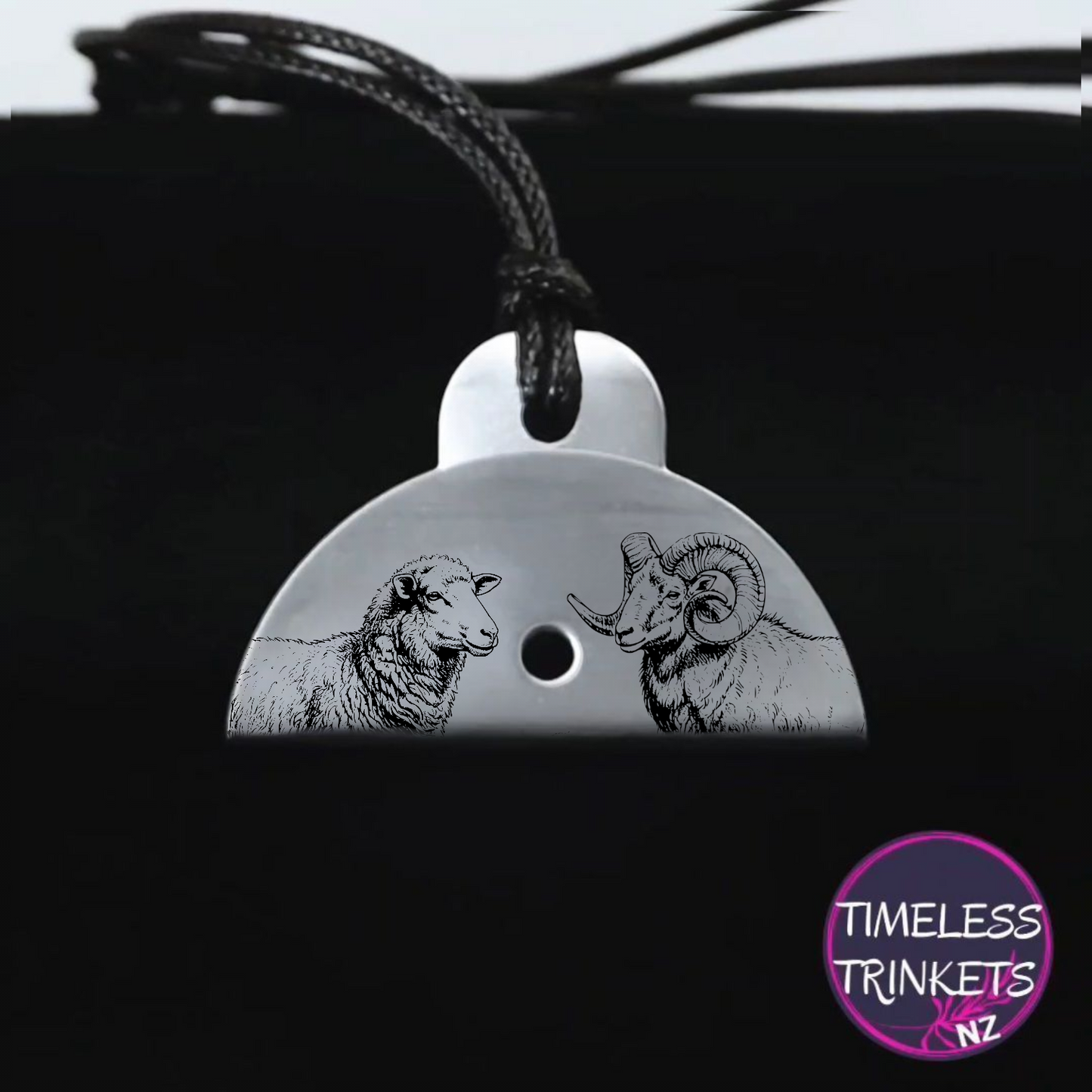 Metal dog whistle with engraved images of a ewe and a ram. Made from stainless steel