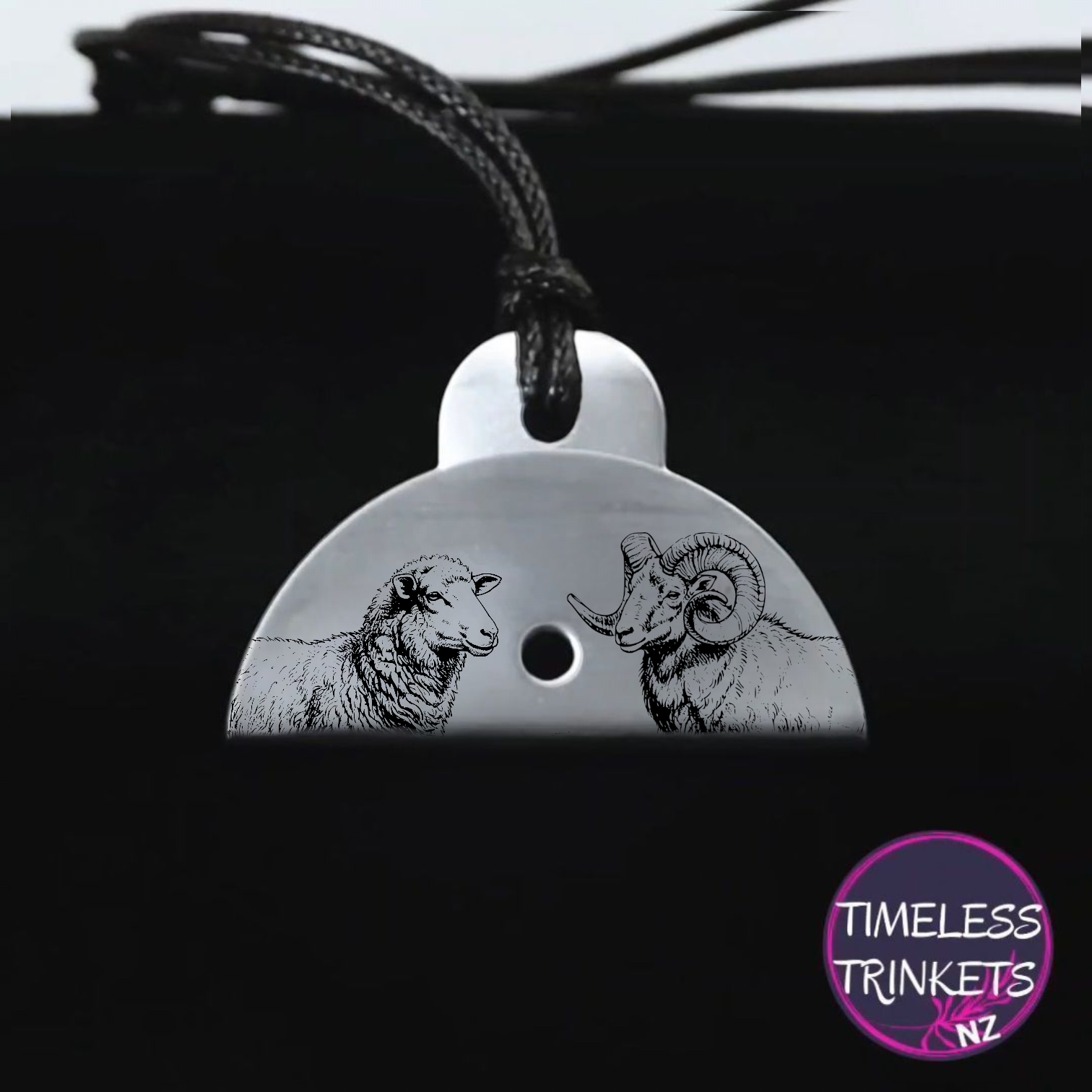 Metal dog whistle with engraved images of a ewe and a ram. Made from stainless steel