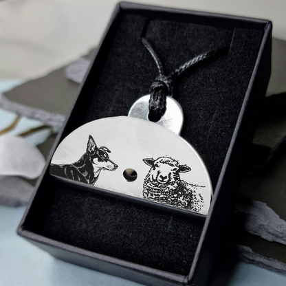 Stainless steel shepherds whistle
pendant with engraved kelpie dog and sheep design in a black gift box