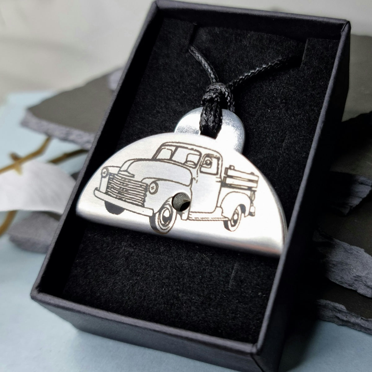 Stainless steel shepherds whistle
with a vintage truck design in a black box