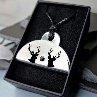 Stainless steel dog whistle
pendant with deer head design in a black gift box