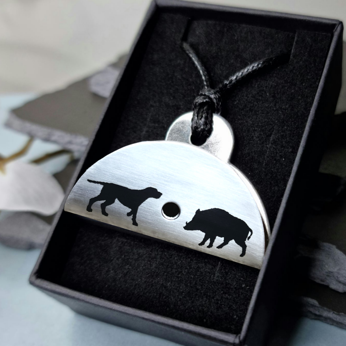 Stainless steel shepherds whistle
with dog and bear engraved silhouettes in a black box